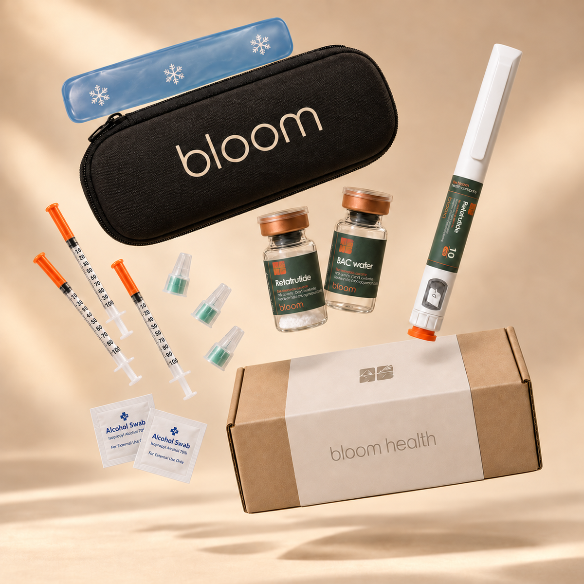 Bloom pouch and box with pen, vials, syringes, pen needles, alcohol swabs and gel ice pack in a warm studio.