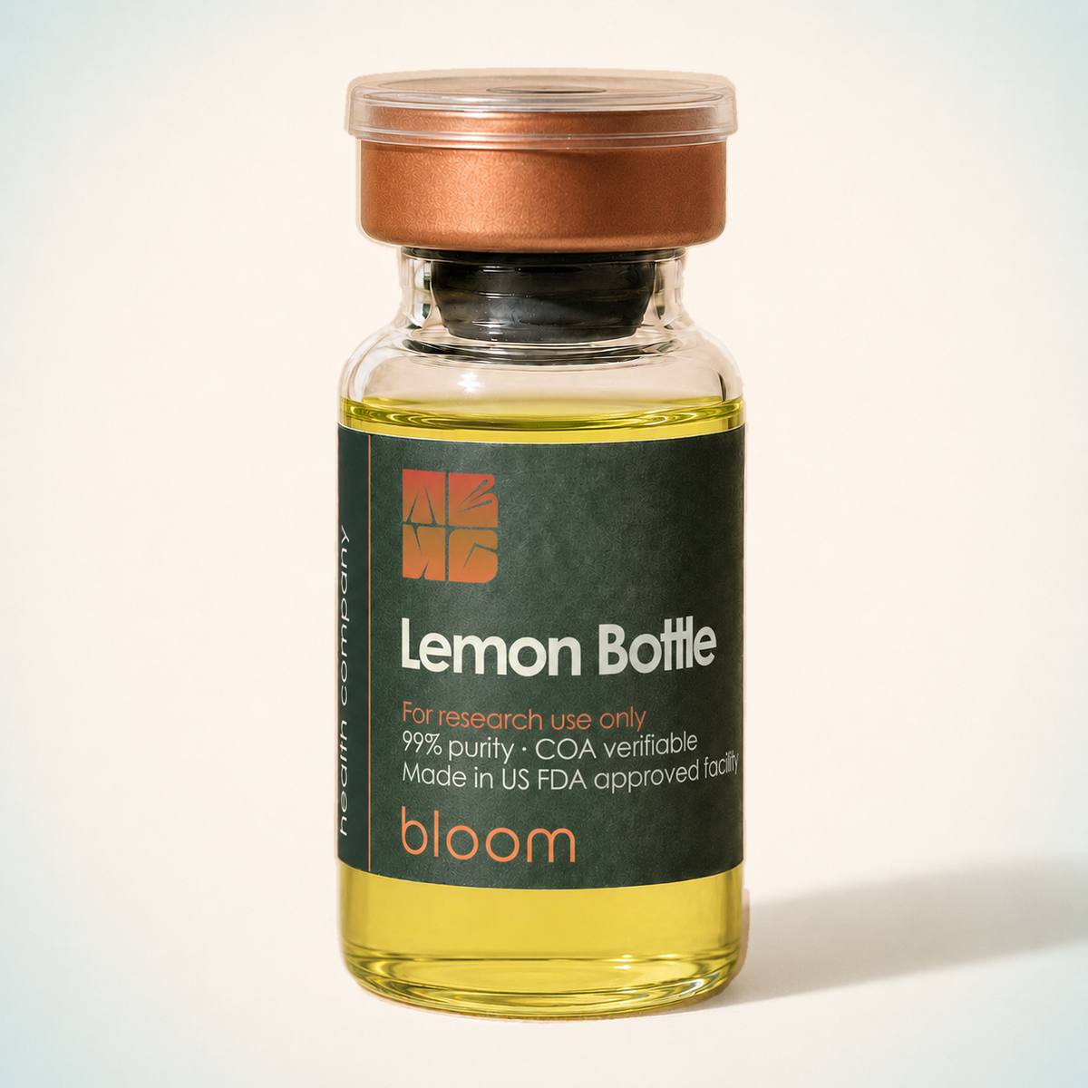 Bloom Lemon Bottle vial on warm ivory background with pale blue-green corners