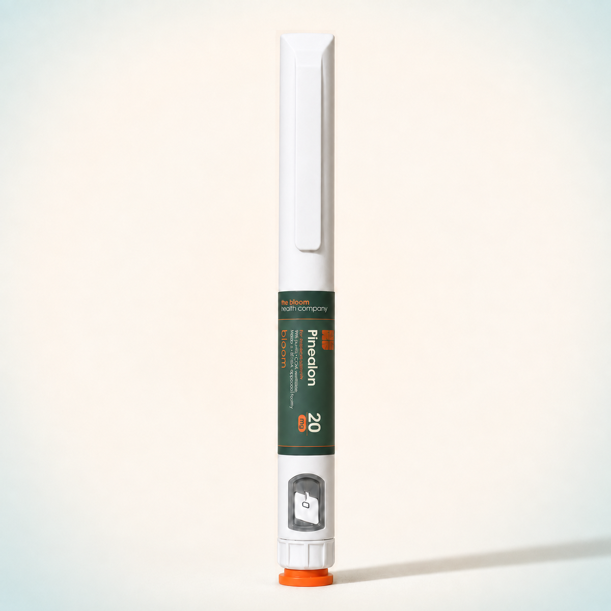 Bloom Pinealon 20 mg prepared pen on warm ivory background with pale blue-green corners