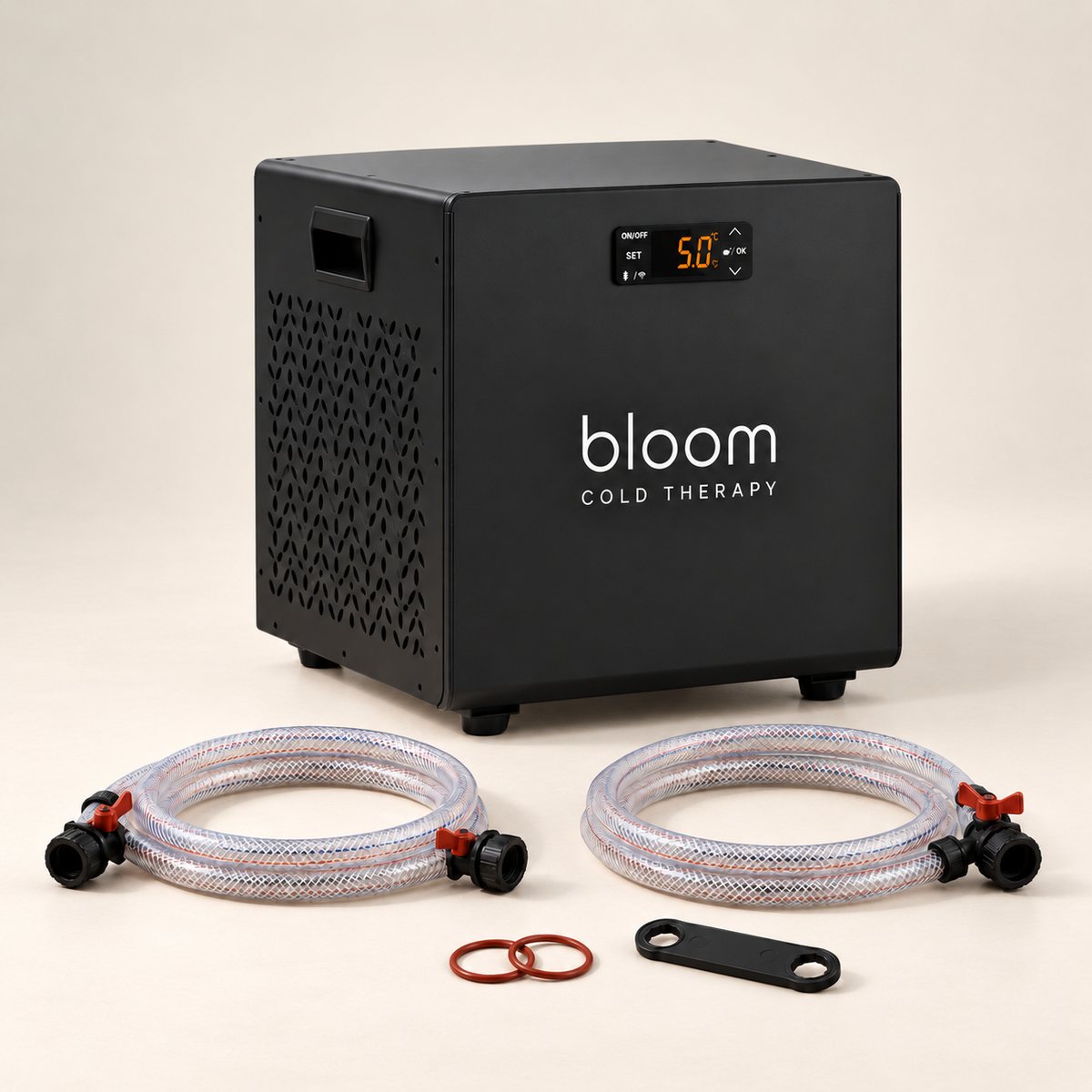 Bloom Ice Core chiller with hoses, seals and wrench on a warm ivory studio backdrop