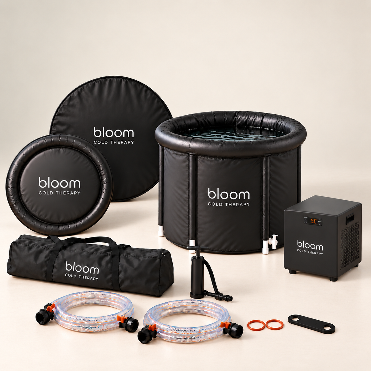 Bloom Ice Core - Set with tub, compact chiller, covers, carry bag, hand pump, connection hoses and fittings on a soft ivory studio backdrop.